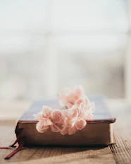 a book with a bunch of flowers on top of it