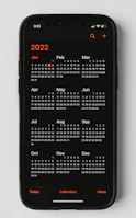 Close-up of a calendar app on a smartphone showing available booking slots.