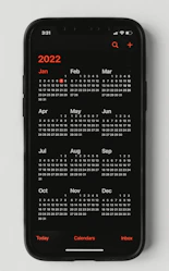A smartphone showing a seamless online booking calendar for easy client reservations.