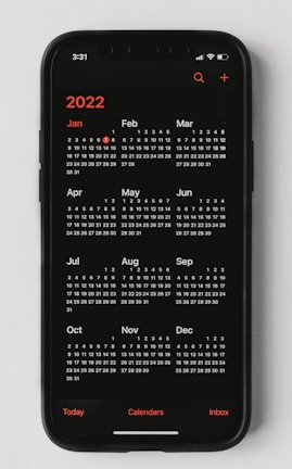 A vibrant monthly calendar view on a digital device with motivational notes and reminders.