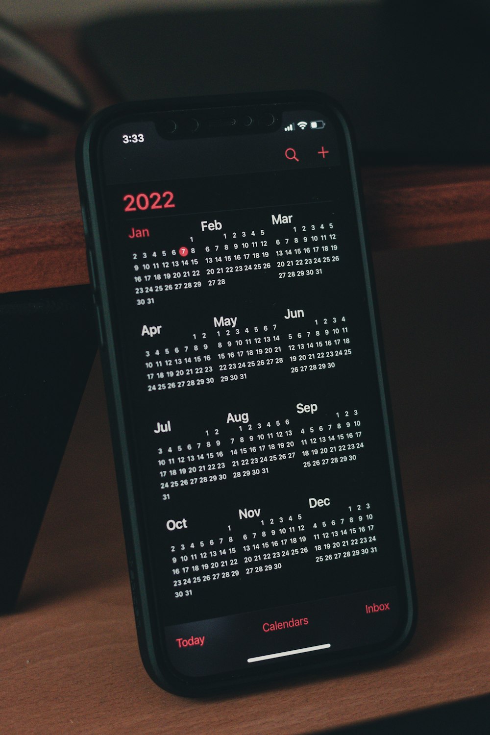 a cell phone with a calendar on the screen