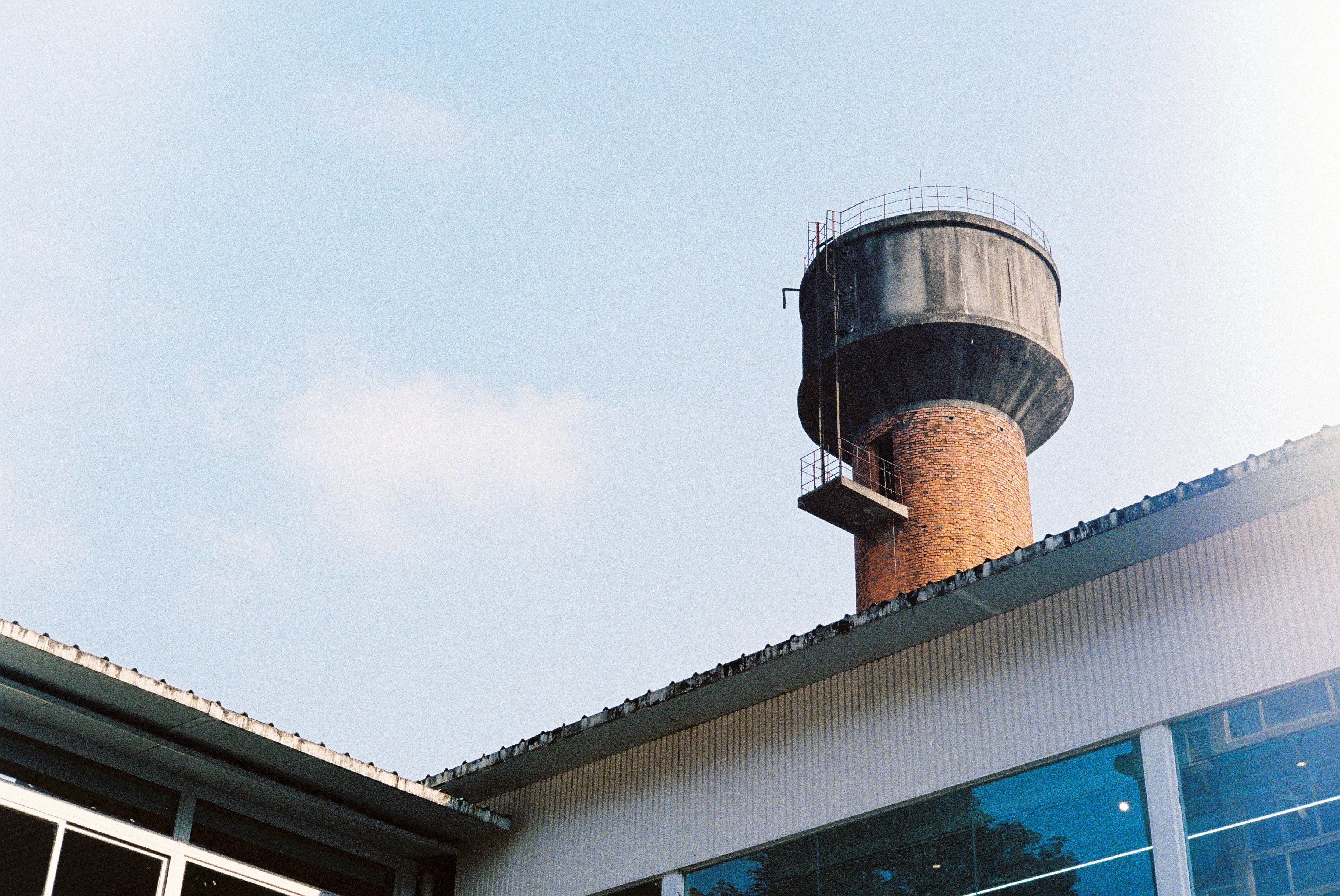 A Water Tower On Top Of A Building