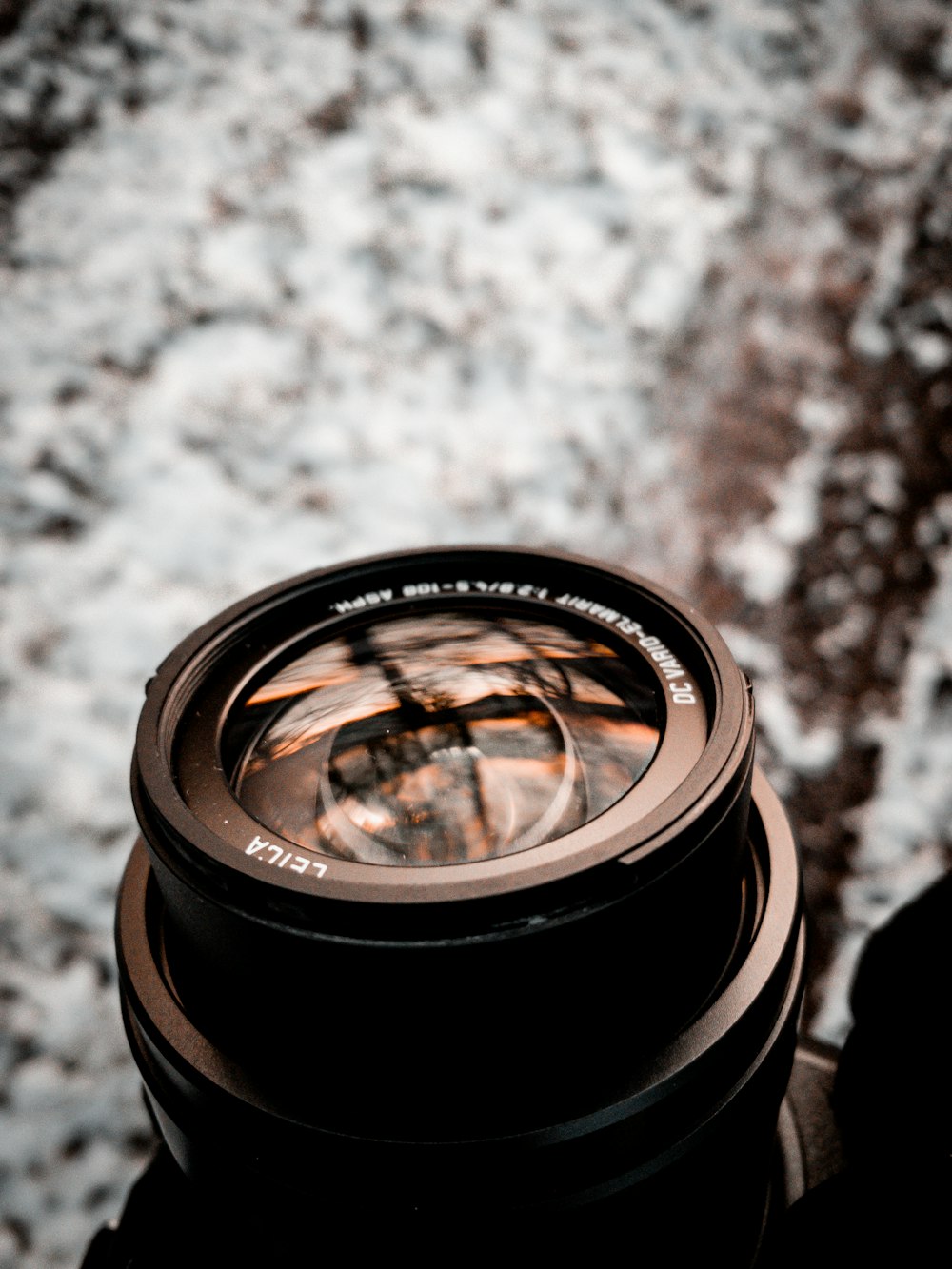 a close up of a camera lens on a tripod