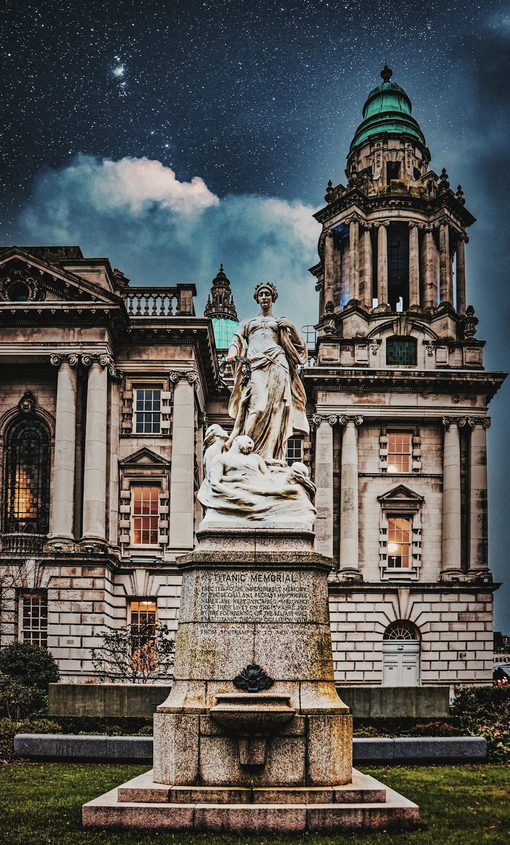 a statue in front of a large building