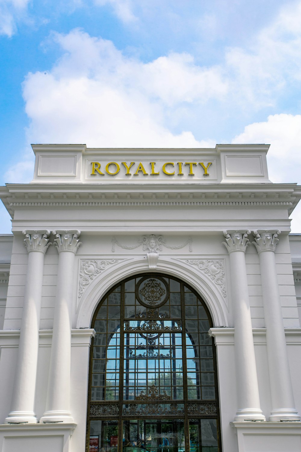 a large white building with a clock on top of it