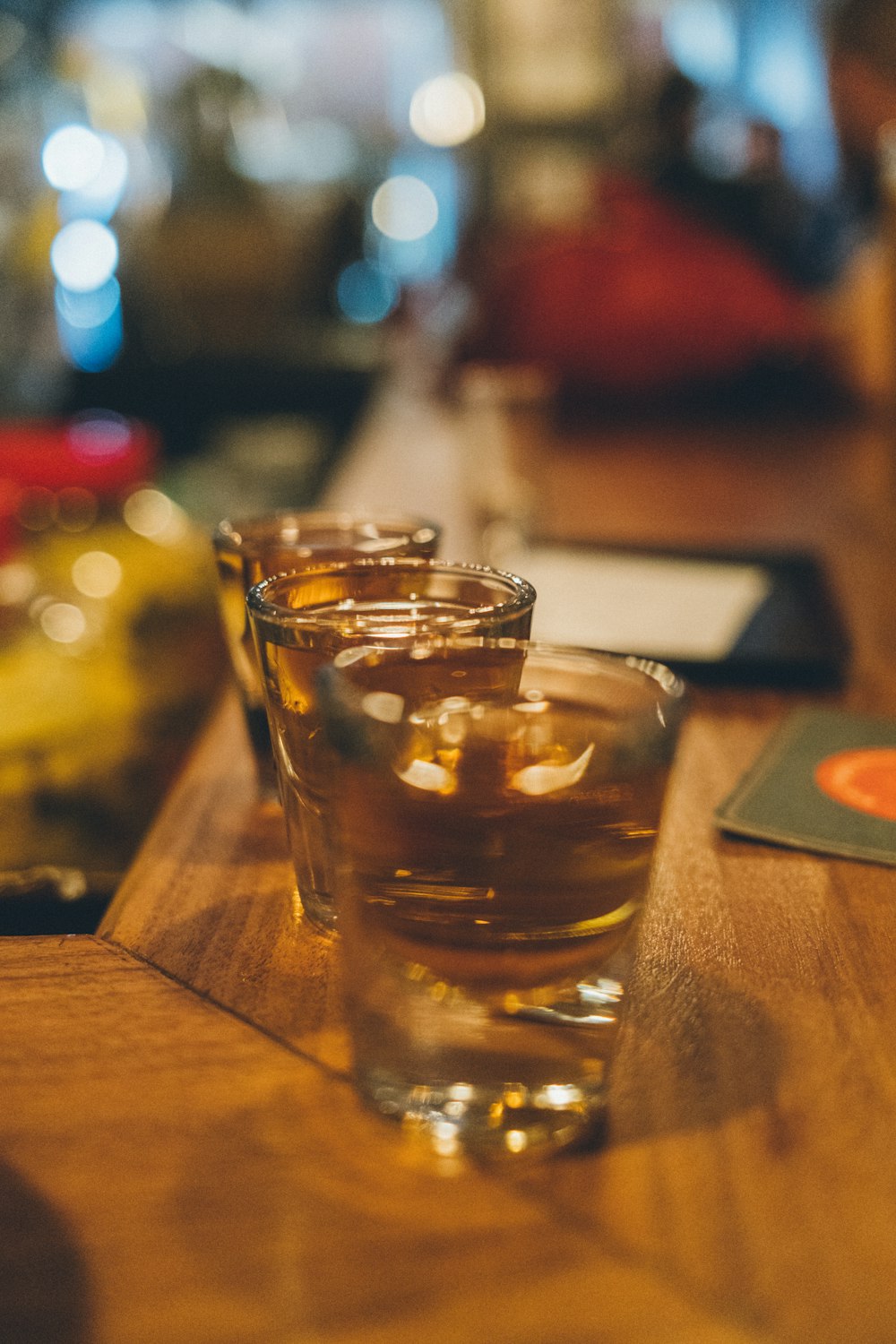 a close up of a glass of alcohol on a table