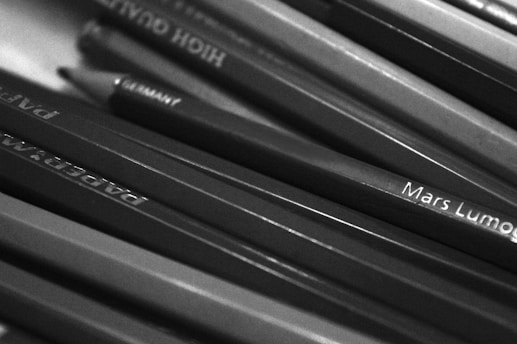 a bunch of pencils that are sitting on a table