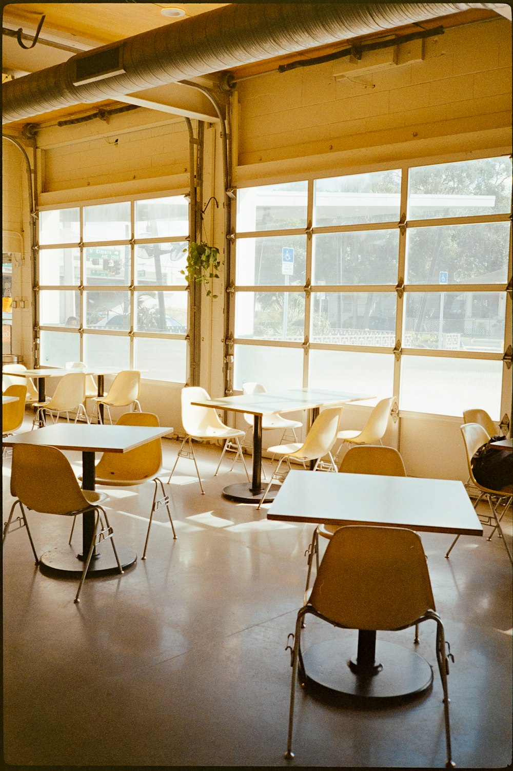 a room filled with lots of tables and chairs