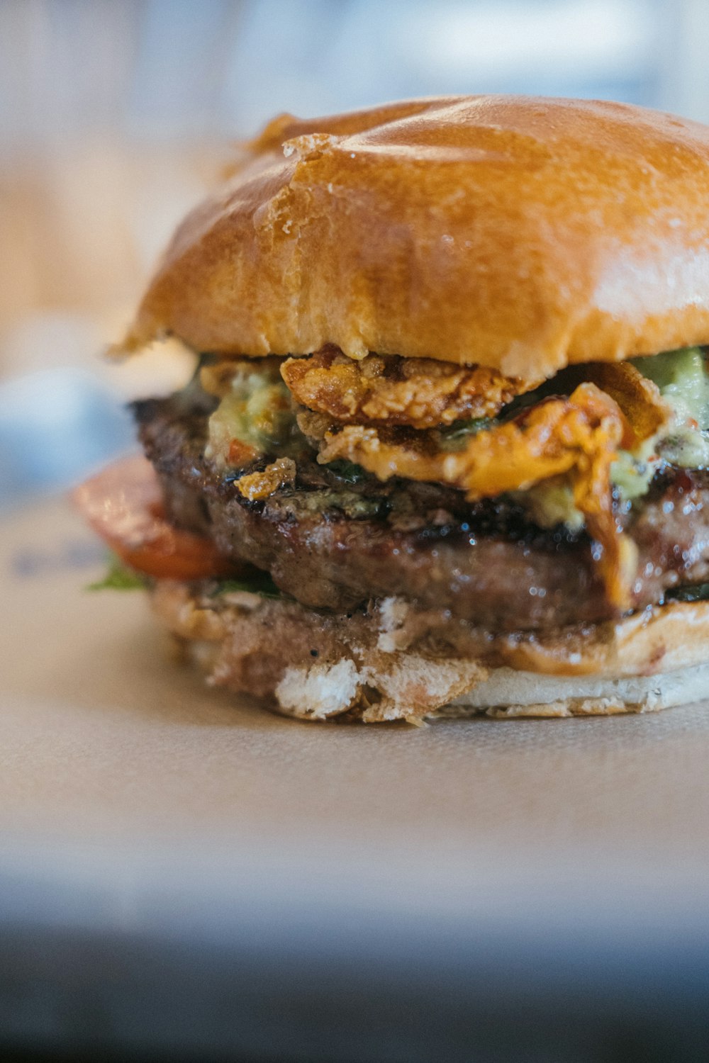 a close up of a burger on a plate