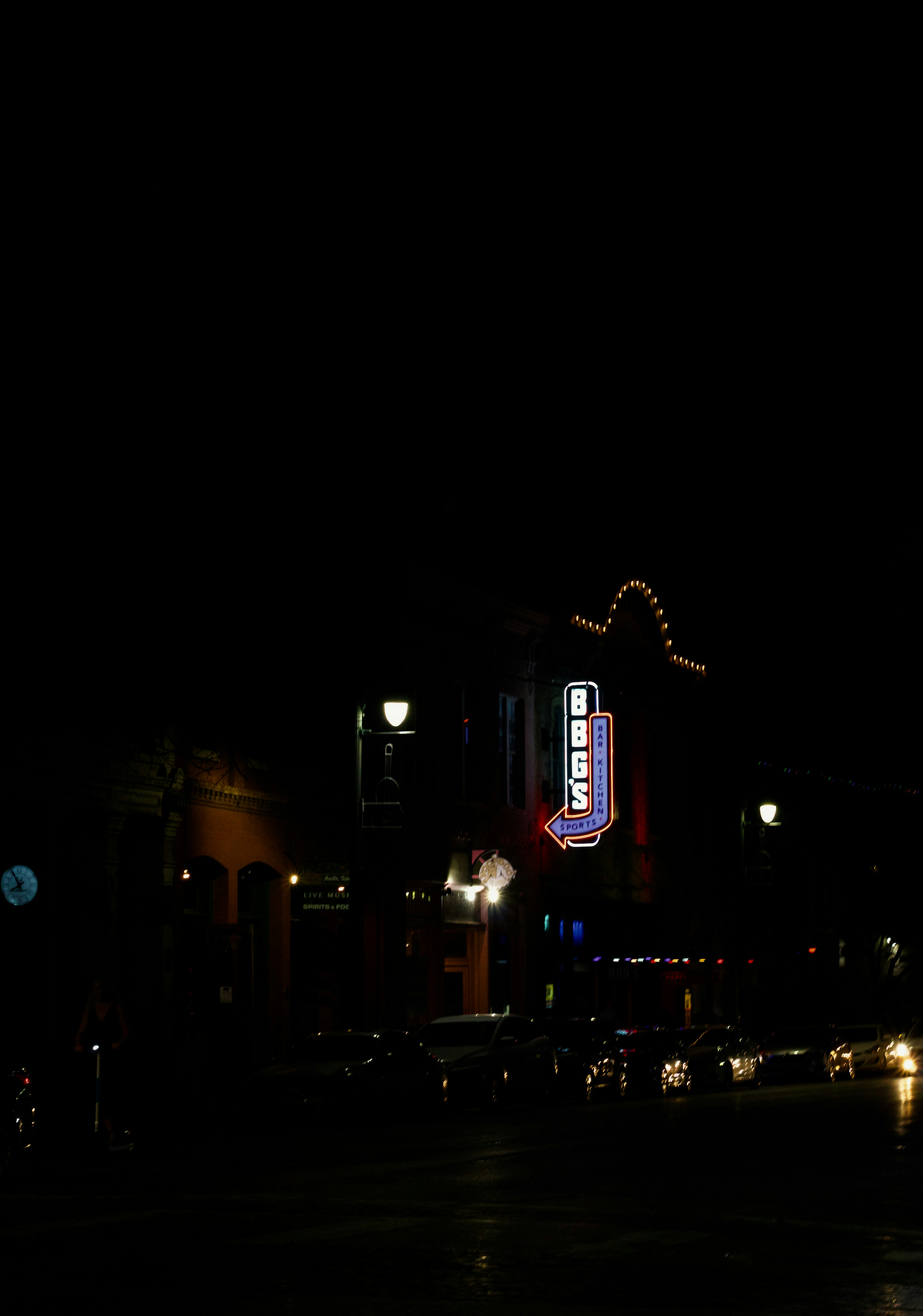 a building lit up at night in the dark