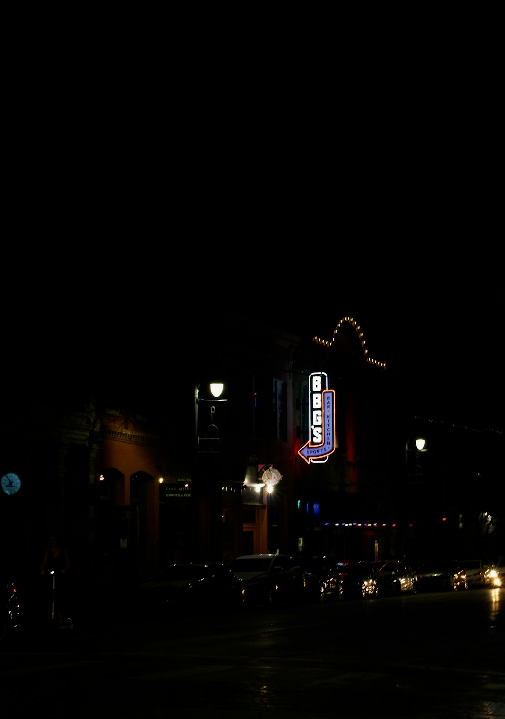 a building lit up at night in the dark