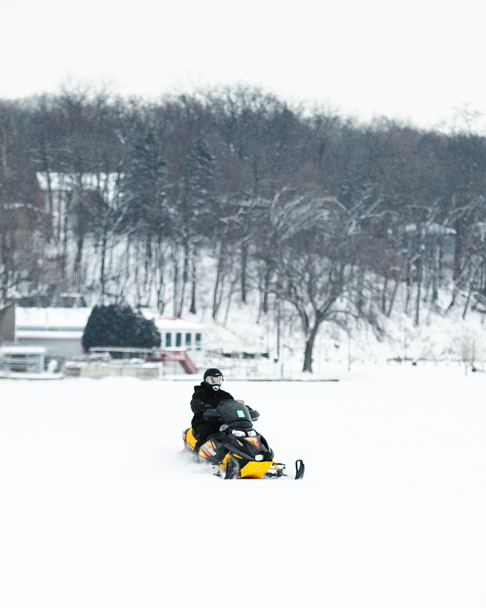 a man riding skis down a snow covered slope