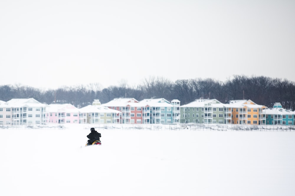 a man that is standing in the snow