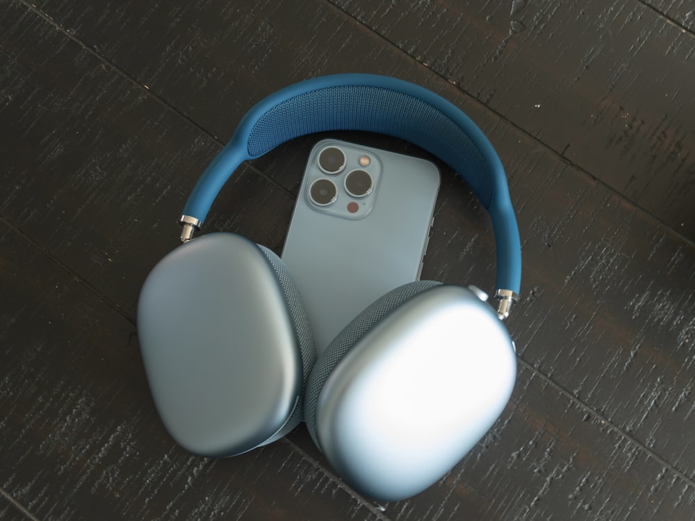 a pair of headphones sitting next to an iphone