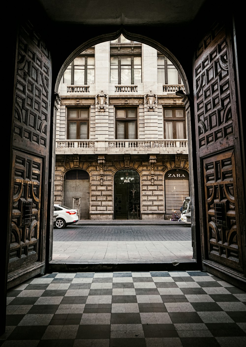 a car is parked in front of a building