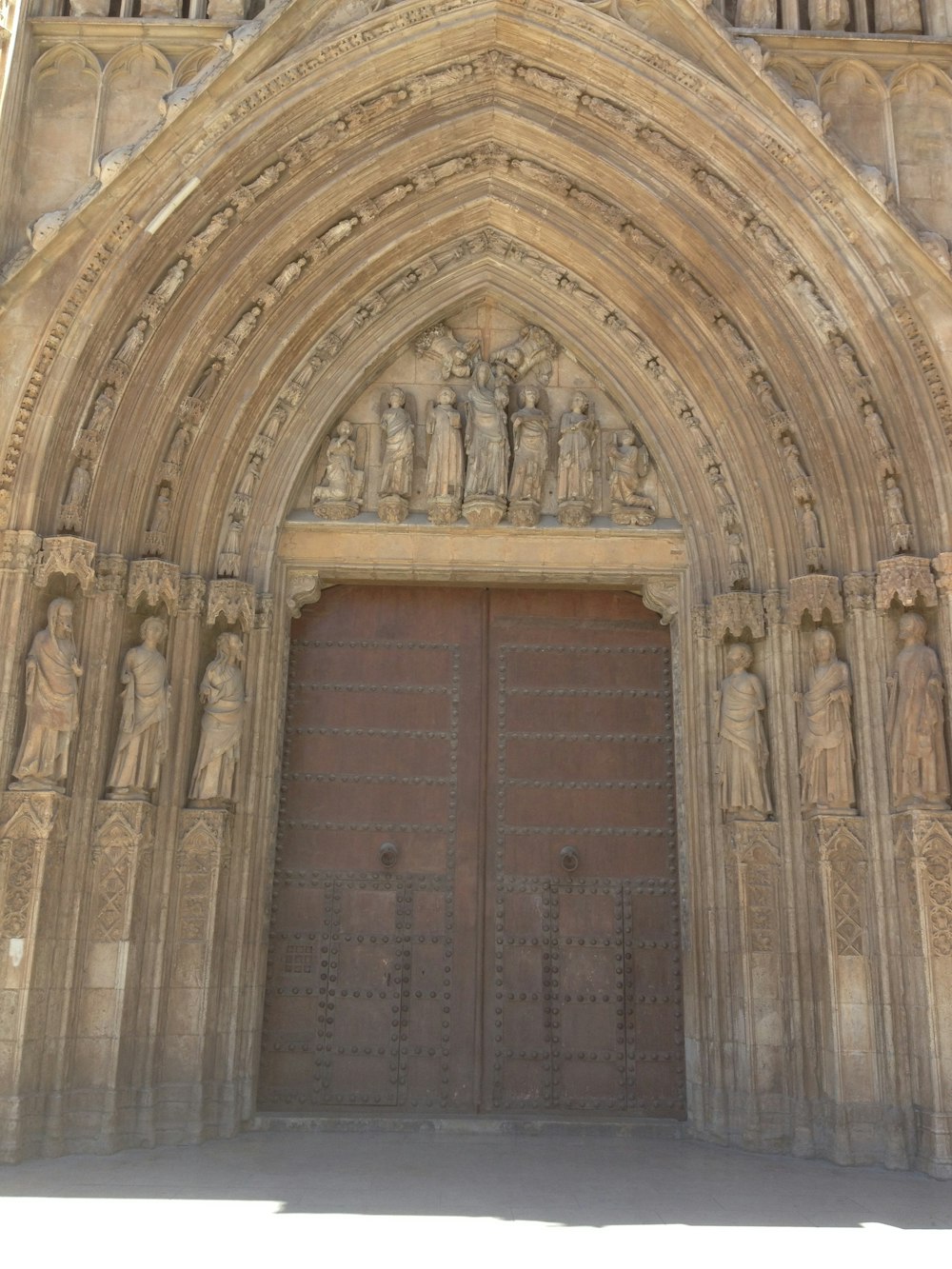 a large stone building with a large wooden door