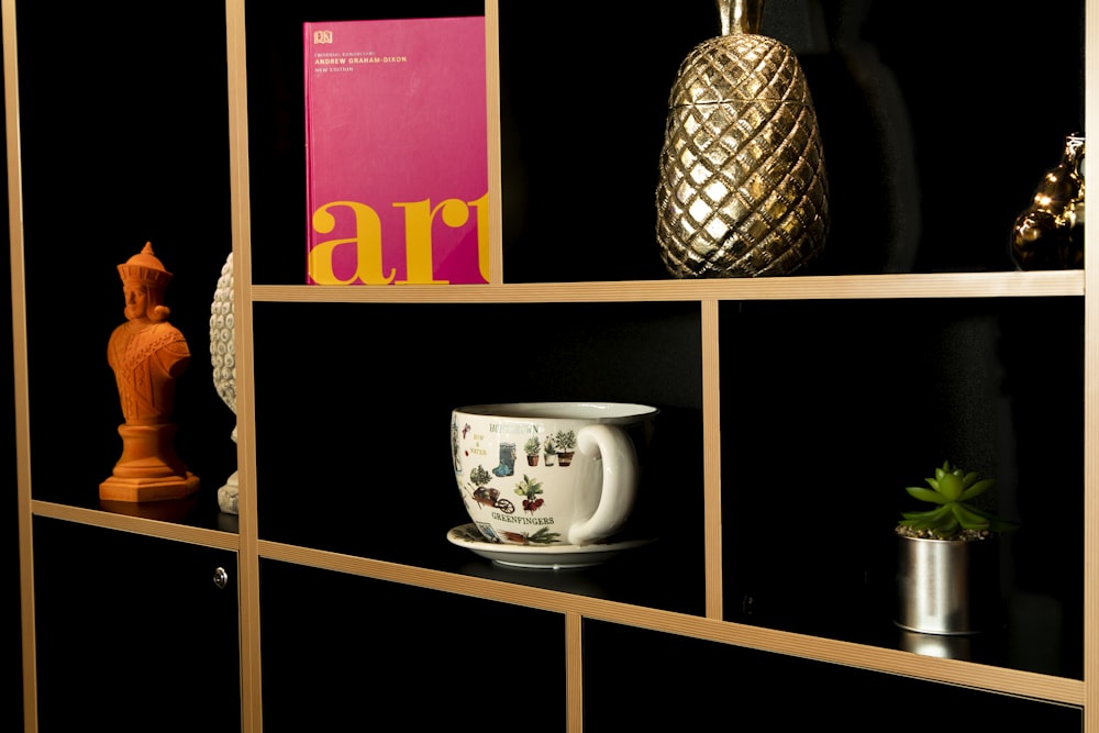 a shelf filled with vases and other items