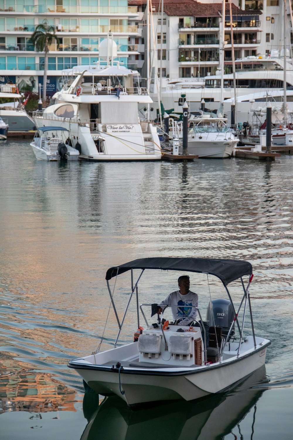 a man driving a boat in the water