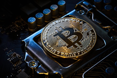 a bitcoin on top of a computer motherboard