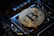 a bitcoin on top of a computer motherboard