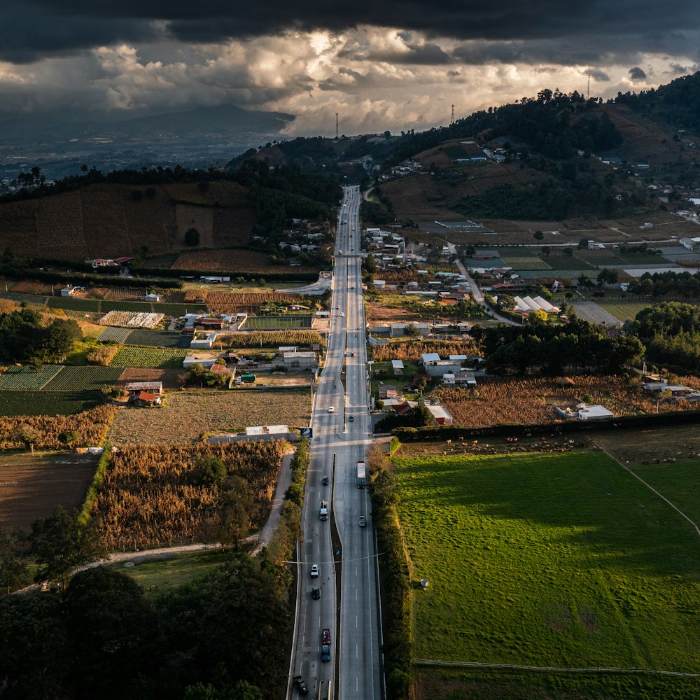 an aerial view of a highway with cars on it