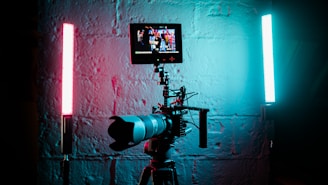 a camera set up in front of a brick wall