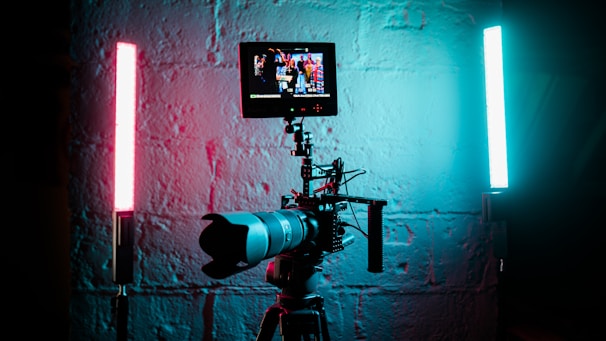 a camera set up in front of a brick wall