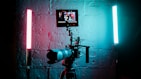 a camera set up in front of a brick wall
