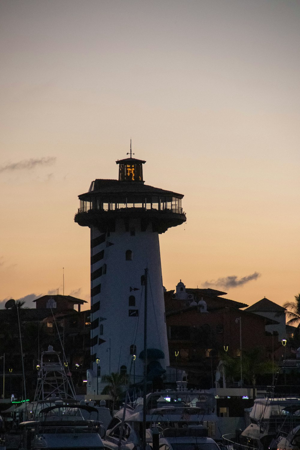 a large white tower with a clock on top of it