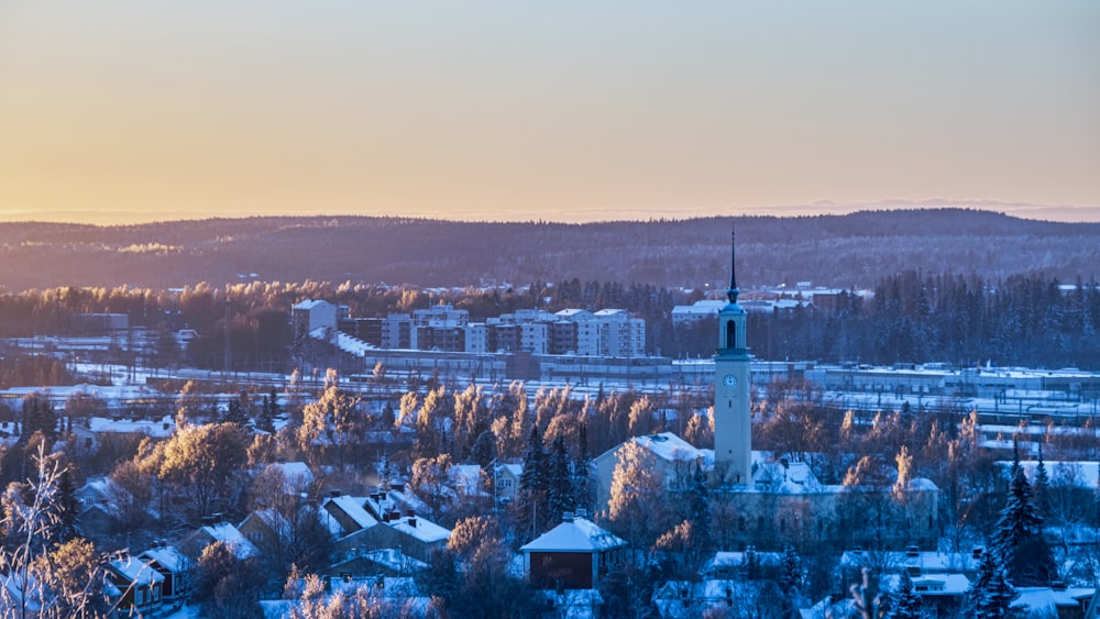 a town with a clock tower in the middle of it