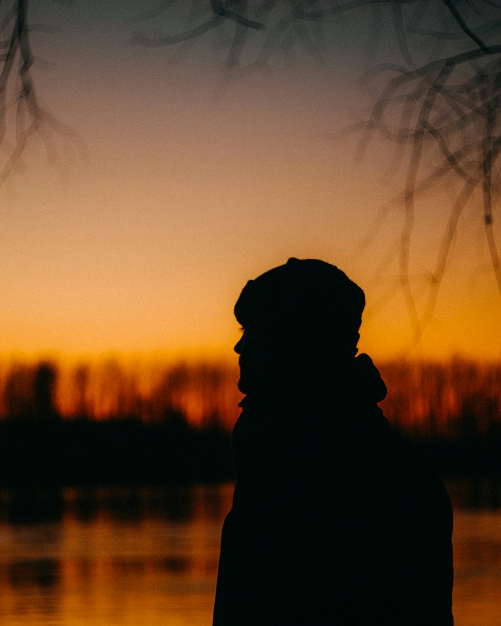 a person standing in front of a body of water