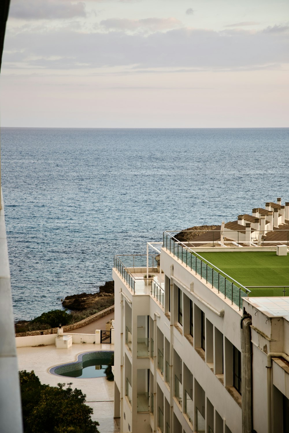 a view of the ocean from a high rise building