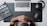 An overhead view featuring a person sitting at a desk with their hands clasped together, looking at a laptop on a dark mouse pad. To the left, there is a film clapperboard, and to the right, a pair of headphones and a computer mouse. The workspace is organized with tech and film elements.