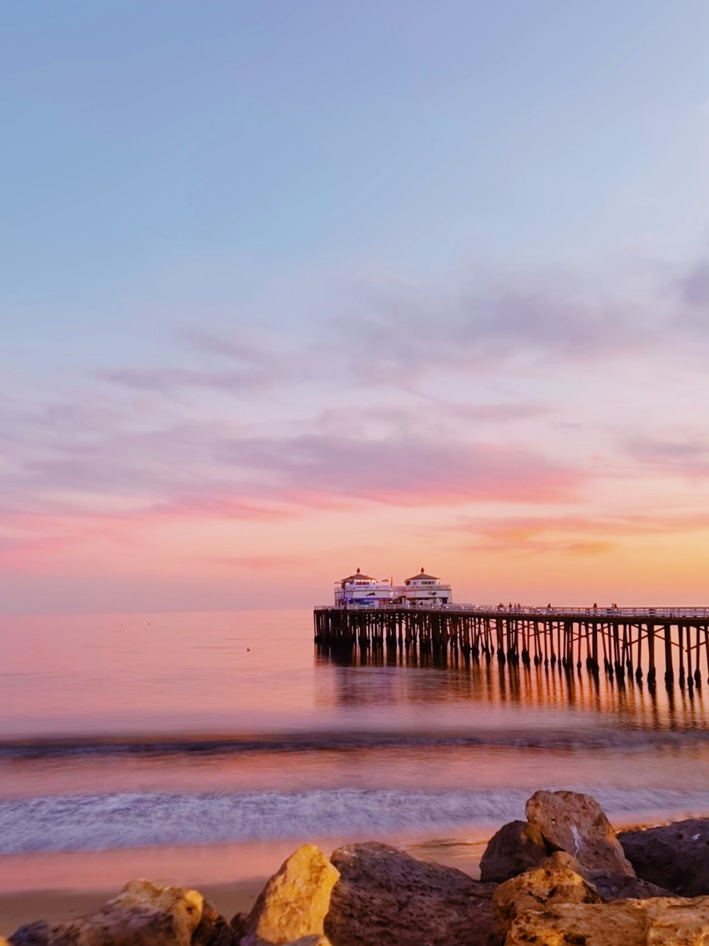 a pier that is next to a body of water