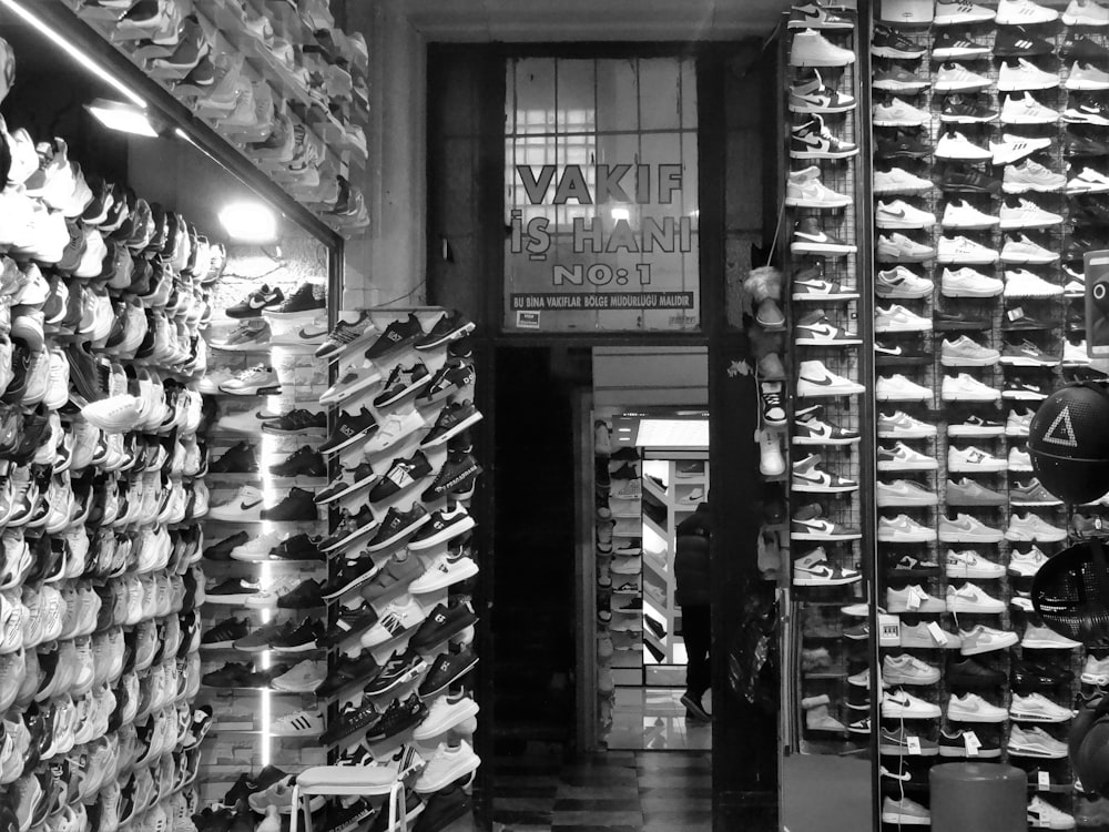 a black and white photo of a shoe store