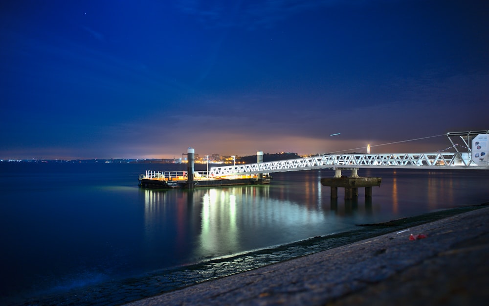 a bridge over a body of water at night