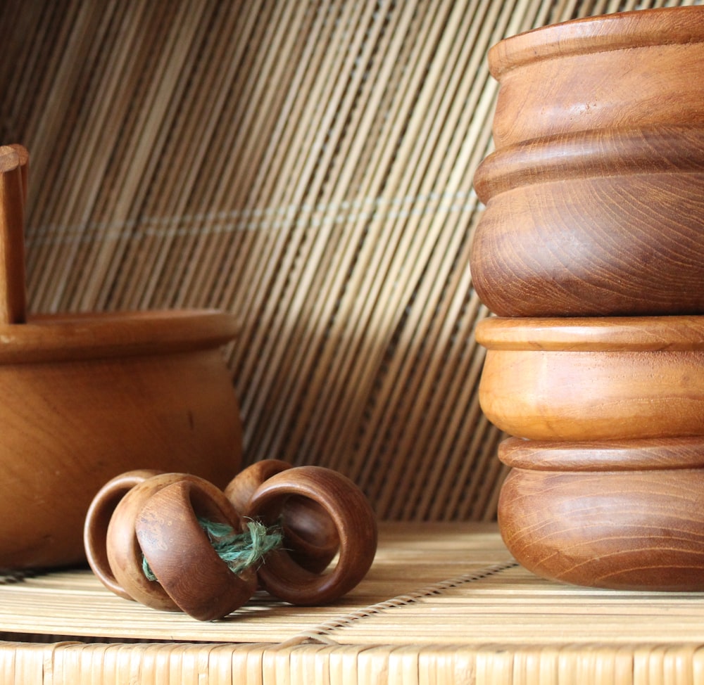 a couple of wooden bowls sitting on top of a table