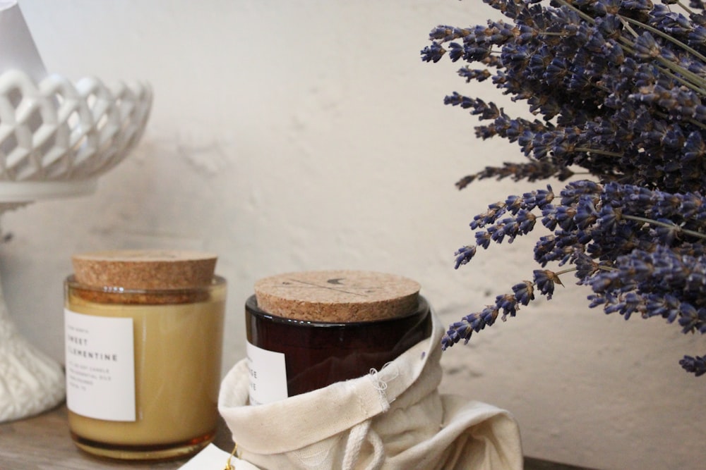 a jar of honey next to a jar of lavender