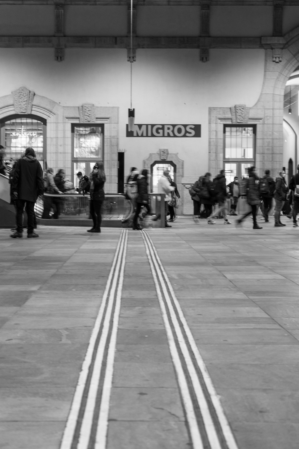 a black and white photo of a train station