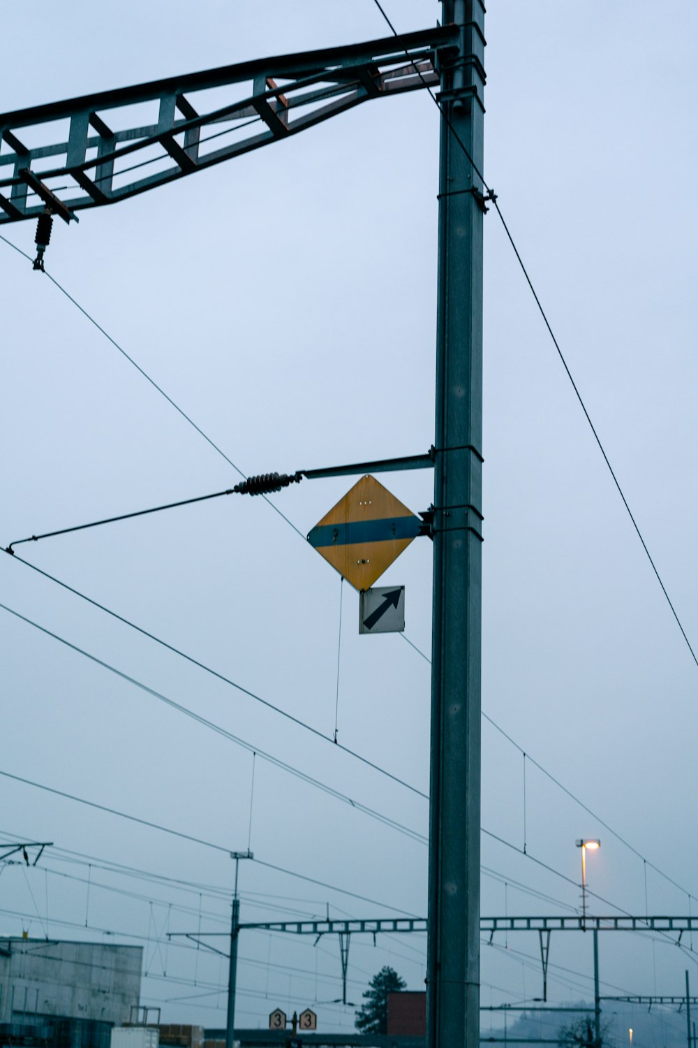 a street sign hanging from the side of a metal pole