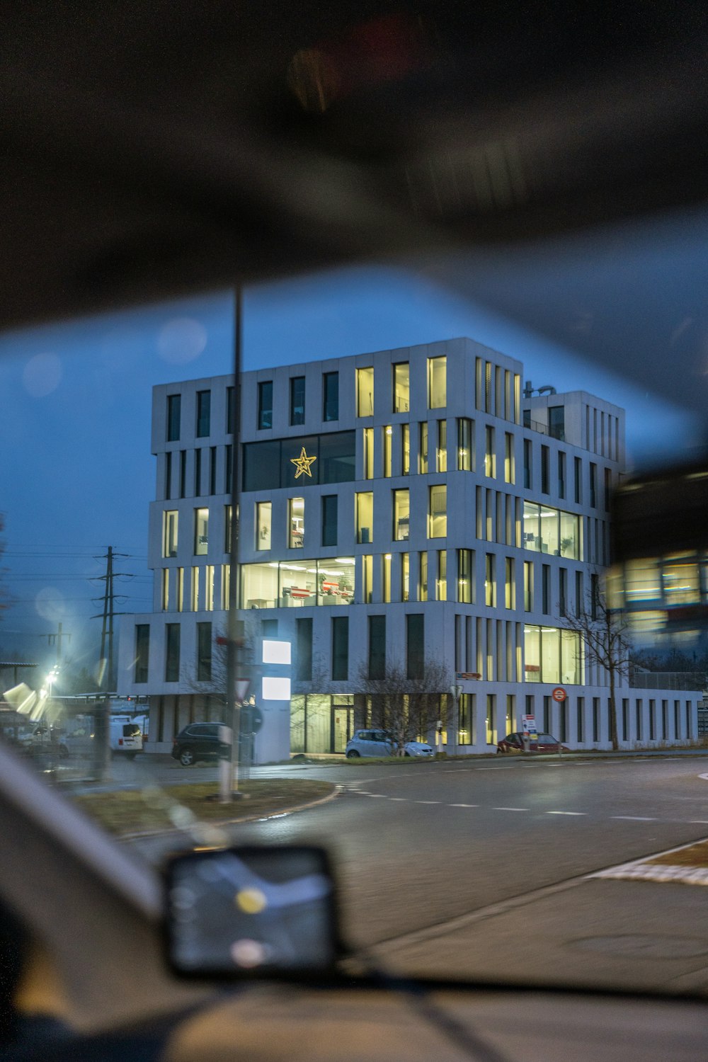 a large white building sitting next to a street