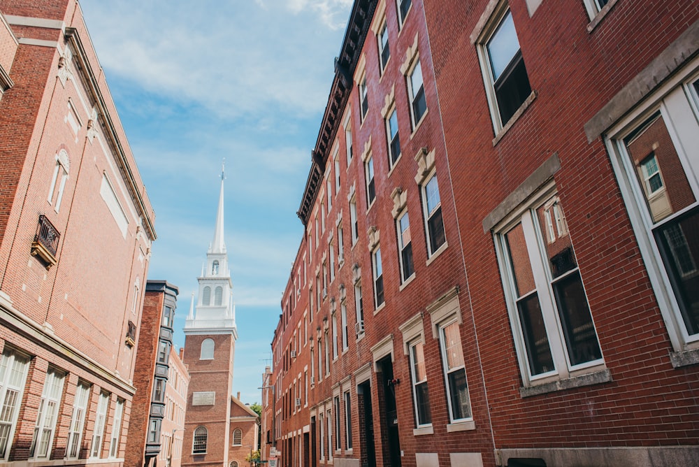 a church steeple towering over a city street