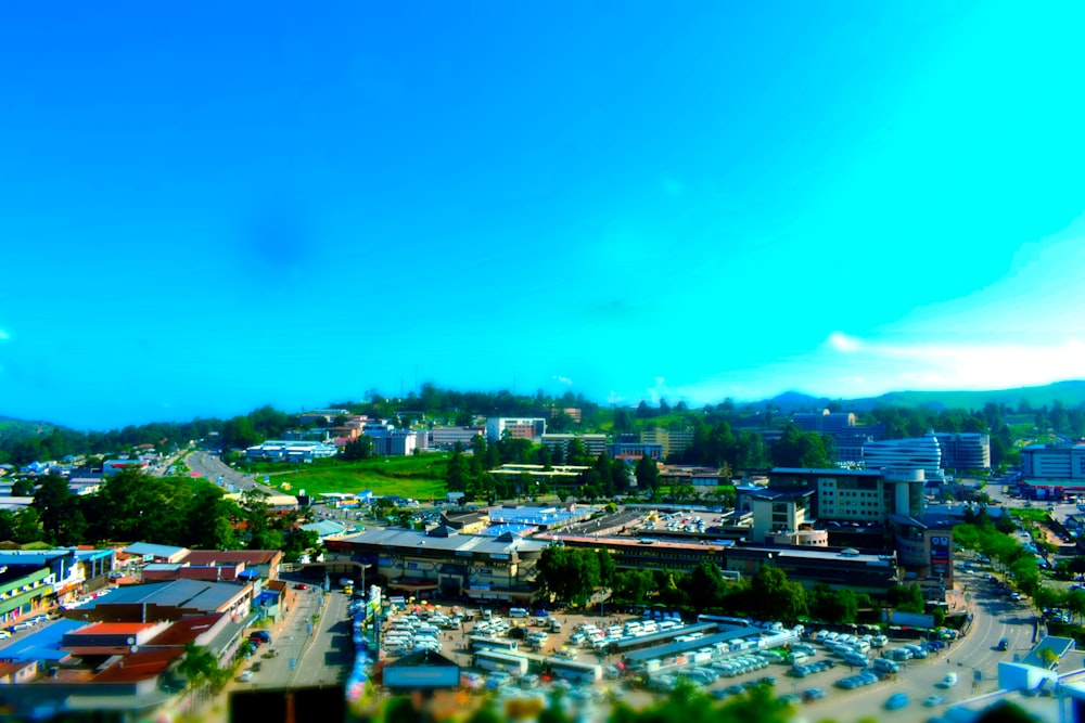 an aerial view of a city with a blue sky