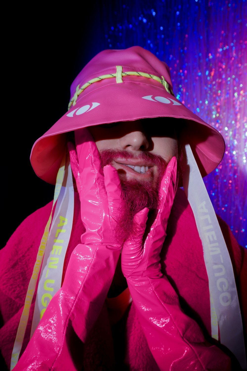 a man wearing a pink hat and pink gloves