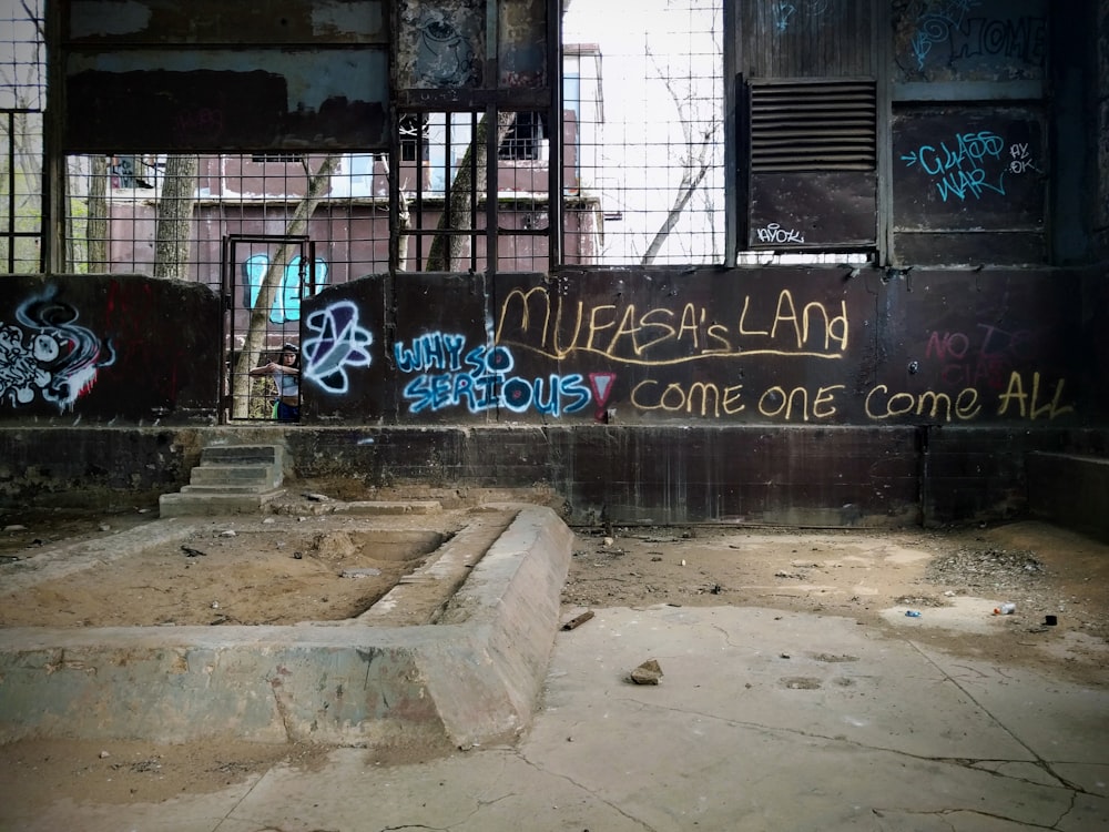 graffiti on a wall in an abandoned building