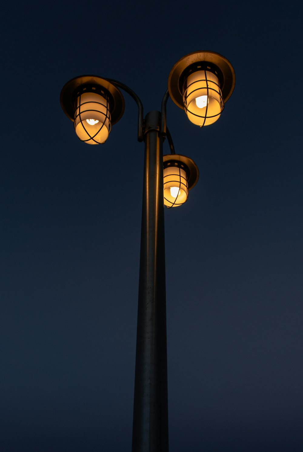 a couple of street lamps sitting next to each other