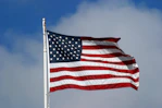an american flag waving in the wind