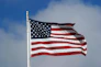 an american flag waving in the wind