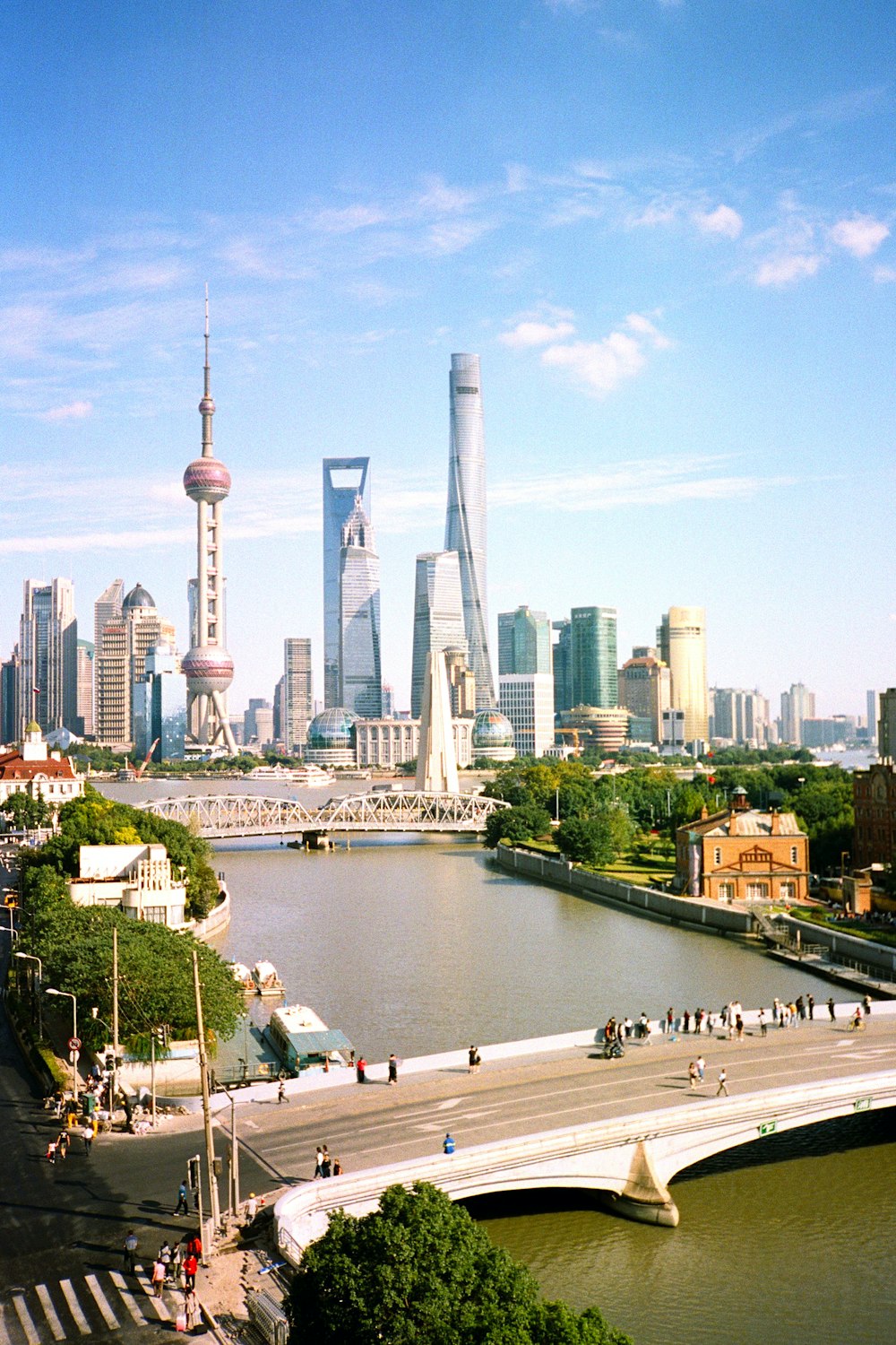 a view of a city from a bridge over a river