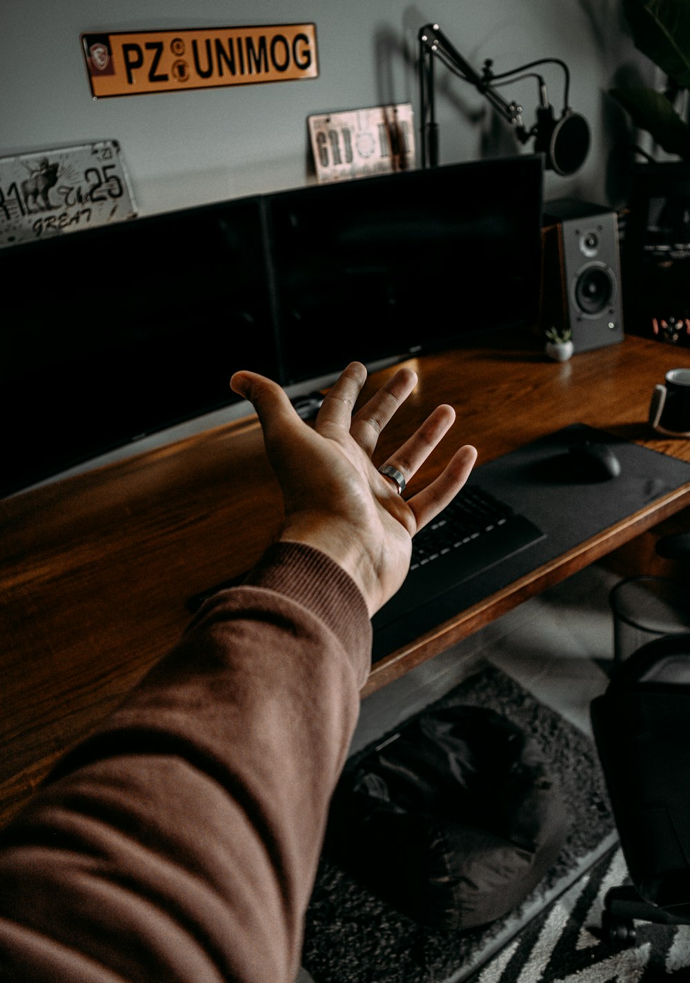 a person sitting at a desk with a laptop computer